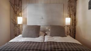 Postel nebo postele na pokoji v ubytování Hôtel Le Grand Chalet Favre