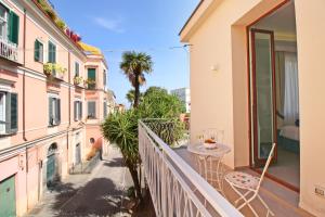 a balcony with a view of a building at Le Camere del Tappezziere in Sant'Agnello