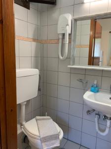 a bathroom with a toilet and a sink at Filoxenia Studios in Skliri +27 photos