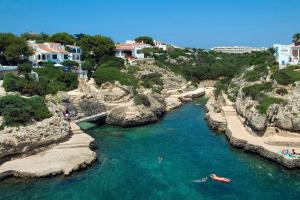 an aerial view of a river with two boats in it at Villa Mercedes by Villa Plus in Cala en Forcat