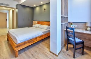 Postel nebo postele na pokoji v ubytování Hotel Dompes