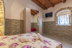 Voodi või voodid majutusasutuse "la Casina del forno con piscina fra Catania e Siracusa " toas