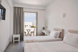 Postel nebo postele na pokoji v ubytování Polos Hotel Paros