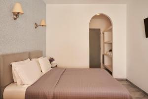 Postel nebo postele na pokoji v ubytování Polos Hotel Paros