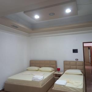 Postel nebo postele na pokoji v ubytování Alexander Stay Hotel