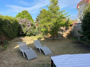 Vonkajšia záhrada v ubytovaní Maison de vacances pour 8 personnes STELLA PLAGE - Villa POPPEE