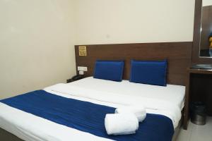 Ένα ή περισσότερα κρεβάτια σε δωμάτιο στο Hotel Satyug