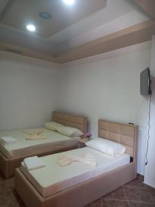 Postel nebo postele na pokoji v ubytování Alexander Stay Hotel