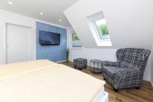 Ένα ή περισσότερα κρεβάτια σε δωμάτιο στο Ferienhaus Friesentraum