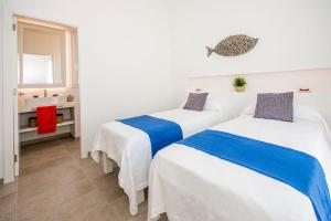 Ein Bett oder Betten in einem Zimmer der Unterkunft Villa Amatista by Villa Plus