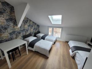Postel nebo postele na pokoji v ubytování RYNEK 2 DUKLA- POKOJE I APARTAMENTY