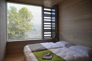 Posteľ alebo postele v izbe v ubytovaní SEE 31, Ferienlofts am Traunsee