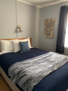 מיטה או מיטות בחדר ב-Motel le repos