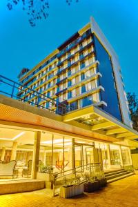 a large hotel building with a lot of windows at Swiss Lenana Mount Hotel in Nairobi