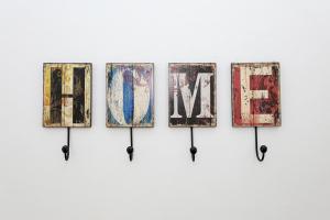 a group of nine pieces of art hanging on a wall at B50 - Main Square Apartment in Lagos in Lagos