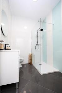 a bathroom with a glass shower and a toilet at B50 - Main Square Apartment in Lagos in Lagos