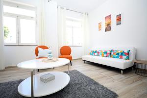 a living room with a couch and a table at B50 - Main Square Apartment in Lagos in Lagos