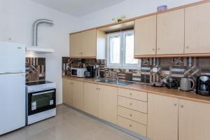 Kuchyň nebo kuchyňský kout v ubytování Hillside Seaview Apartment + 37 fotografií