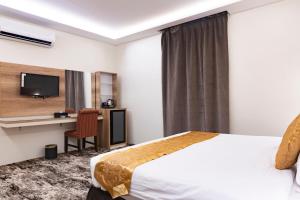 Katil atau katil-katil dalam bilik di Garden View Suites