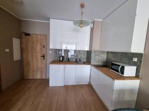 Kuchyň nebo kuchyňský kout v ubytování Apartamenty Ustronie Morskie Apartments + 10 fotografií
