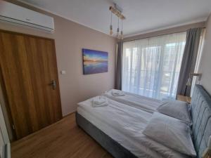 Postel nebo postele na pokoji v ubytování Apartamenty Ustronie Morskie Apartments