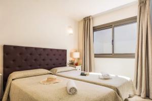 Postel nebo postele na pokoji v ubytování Villa Pino by Villa Plus