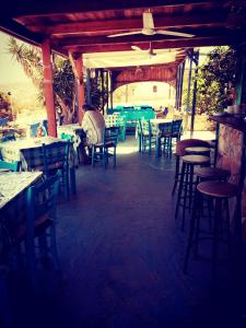 a group of tables and chairs in a restaurant at Metochi Gavdos in Gavdos