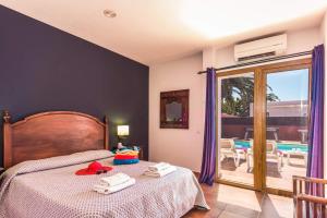 A bed or beds in a room at Villa Silvia II by Villa Plus