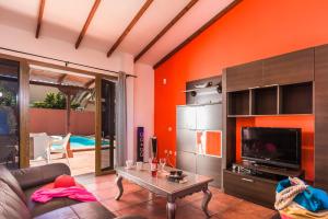 A seating area at Villa Silvia II by Villa Plus