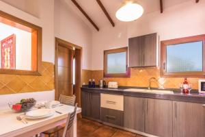 A kitchen or kitchenette at Villa Silvia II by Villa Plus