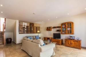 A television and/or entertainment centre at Villa Buena Vista by Villa Plus
