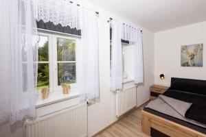Postel nebo postele na pokoji v ubytování Apartmán 21 Hubertus