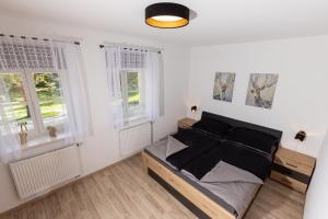 Postel nebo postele na pokoji v ubytování Apartmán 21 Hubertus