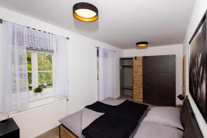 Postel nebo postele na pokoji v ubytování Apartmán 21 Hubertus