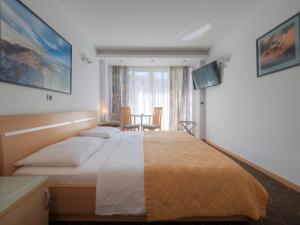 Cama ou camas em um quarto em Hotel Montenegro