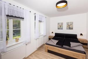 Postel nebo postele na pokoji v ubytování Apartmán 21 Hubertus