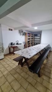 a large table in the middle of a room at Hotel Paraná BC in Balneário Camboriú