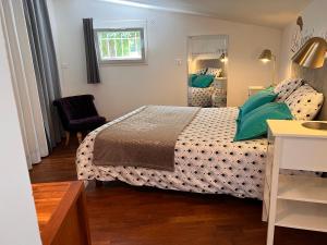 Postel nebo postele na pokoji v ubytování Adorable Gîte (10mn Uzès)