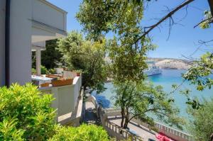 a house with a view of the water at Apartmani 'Mirijana Gabrić' A3 in Lopar