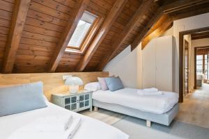 A bed or beds in a room at Luderna - Apartamento Arties era Cabaneta