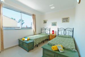 Postel nebo postele na pokoji v ubytování Villa Tamarindos by Villa Plus + 18 fotografií