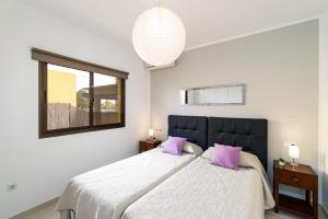 Postel nebo postele na pokoji v ubytování Villa Papagayo Deluxe by Villa Plus + 9 fotografií