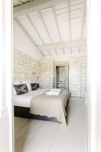 מיטה או מיטות בחדר ב-Hôtel Restaurant Les Arnelles