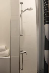 a shower with a glass door in a bathroom at Hotel National Antwerp in Antwerp