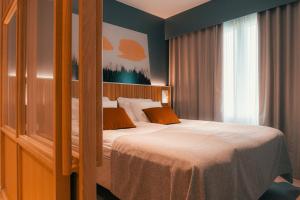 En eller flere senge i et værelse på Original Sokos Hotel Seurahuone Savonlinna