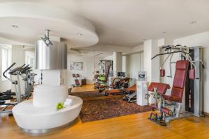 a gym with several treadmills and exercise machines at Clarion Congress Hotel Bratislava in Bratislava