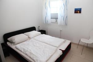 En eller flere senge i et værelse på Blaue Möwe