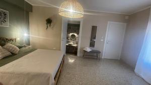 A bed or beds in a room at Santa Lucia Affittacamere