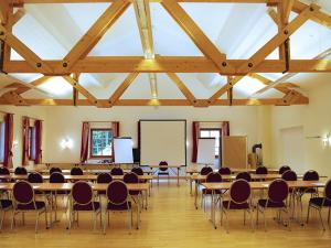 a large room with tables and chairs in it at Steinschalerhof in Warth