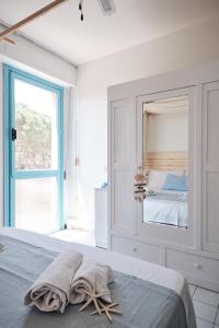 A bed or beds in a room at Green Coast House 1